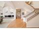 Impressive curved staircase with metal railings, hardwood floors, and an open concept at 15895 W Bayaud Dr, Golden, CO 80401