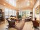 Bright sunroom featuring wicker furniture and wood ceiling at 15895 W Bayaud Dr, Golden, CO 80401