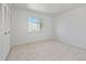 Bright bedroom with a window, closet, and neutral carpet at 9910 Winona St, Westminster, CO 80031