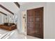 Inviting entryway featuring a solid wood door and direct access to a comfortable living room at 9910 Winona St, Westminster, CO 80031