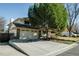 This two-story home offers an attached garage and a long driveway, providing ample parking and convenience at 9910 Winona St, Westminster, CO 80031