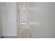 Hallway featuring clean white walls and carpet leading to multiple rooms with large closets at 9910 Winona St, Westminster, CO 80031