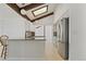 Bright kitchen featuring stainless steel appliances, granite countertops, a breakfast bar, and a skylight at 9910 Winona St, Westminster, CO 80031