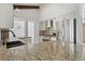 Bright kitchen featuring stainless steel appliances, granite countertops, white cabinets and mosaic backsplash at 9910 Winona St, Westminster, CO 80031