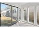 Sunroom with sliding glass door access to the fenced backyard at 9910 Winona St, Westminster, CO 80031