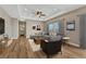 Inviting living room features hardwood floors, ceiling fan, recessed lighting, and a large window at 46120 County Road 17, Elizabeth, CO 80107