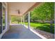 Covered back porch with a ceiling fan and a view of the private backyard at 3480 Spruce Dell Ct, Castle Rock, CO 80109