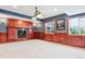 Basement Gathering room with wood trim and fireplace plus decorative windows at 3480 Spruce Dell Ct, Castle Rock, CO 80109