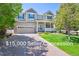Charming two-story home with a large front lawn, attached two car garage, and a cozy front porch at 3480 Spruce Dell Ct, Castle Rock, CO 80109