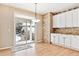 Charming kitchen area with backyard access, and stylish brick backsplash at 3480 Spruce Dell Ct, Castle Rock, CO 80109