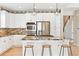 Well-lit kitchen with stainless appliances, granite countertops, and custom pendant lighting at 3480 Spruce Dell Ct, Castle Rock, CO 80109