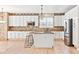 Spacious kitchen with white cabinetry, granite countertops, and stainless steel appliances at 3480 Spruce Dell Ct, Castle Rock, CO 80109