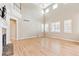 Bright open living room with a fireplace and lots of natural light through large windows at 3480 Spruce Dell Ct, Castle Rock, CO 80109