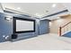 Basement theater room and nearby staircase offer an entertainment area at 3480 Spruce Dell Ct, Castle Rock, CO 80109