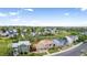 Aerial view of a house in a neighborhood with ample greenery and clear skies at 5733 Whitechapel St, Castle Rock, CO 80104