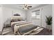 Staged bedroom with a neutral color scheme and modern furnishings at 5733 Whitechapel St, Castle Rock, CO 80104
