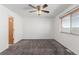 Bedroom with neutral carpeting, window, and entry door at 5733 Whitechapel St, Castle Rock, CO 80104
