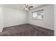 Empty bedroom featuring neutral carpeting and natural light at 5733 Whitechapel St, Castle Rock, CO 80104