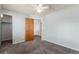 Simple bedroom featuring soft carpeting, closet, and doorway at 5733 Whitechapel St, Castle Rock, CO 80104