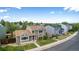 Street view of charming home with neat front lawn and mature trees under a sunny sky at 5733 Whitechapel St, Castle Rock, CO 80104