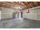 Garage with overhead lighting and door to backyard at 5733 Whitechapel St, Castle Rock, CO 80104