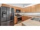 Bright kitchen features stainless steel appliances and light wood cabinets at 5733 Whitechapel St, Castle Rock, CO 80104