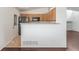 Open kitchen view with stainless steel refrigerator and a breakfast bar at 5733 Whitechapel St, Castle Rock, CO 80104