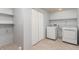 Laundry room equipped with a washer, dryer, shelves, and large closet for storage at 5733 Whitechapel St, Castle Rock, CO 80104