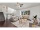 Bright living room with a ceiling fan, a view from the large window, and neutral decor at 5733 Whitechapel St, Castle Rock, CO 80104