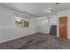 Spacious living room with a large window and neutral carpeting at 5733 Whitechapel St, Castle Rock, CO 80104
