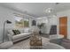 Cozy staged living room with a neutral color palette and modern decor at 5733 Whitechapel St, Castle Rock, CO 80104