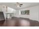 Bright living room with a ceiling fan, view from the window, and staircase access at 5733 Whitechapel St, Castle Rock, CO 80104