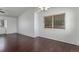 Living room with hardwood floors, ceiling fan, ample natural light, and blank canvas at 5733 Whitechapel St, Castle Rock, CO 80104