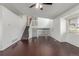 Living room features hardwood floors, staircase, and ample natural light at 5733 Whitechapel St, Castle Rock, CO 80104