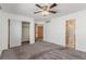 Carpeted primary bedroom with closet and attached bathroom at 5733 Whitechapel St, Castle Rock, CO 80104
