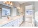 Double vanity bathroom with a large mirror at 8871 S Quemoy St, Aurora, CO 80016