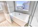 Bathroom with a freestanding bathtub and shower at 8871 S Quemoy St, Aurora, CO 80016