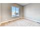 Simple carpeted bedroom with a window at 8871 S Quemoy St, Aurora, CO 80016