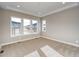 Bright and airy bedroom with neutral carpet and large windows at 8871 S Quemoy St, Aurora, CO 80016