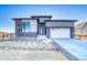 Modern two-story home with stone and siding exterior at 8871 S Quemoy St, Aurora, CO 80016