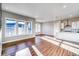 Bright living room with hardwood floors and large windows at 8871 S Quemoy St, Aurora, CO 80016