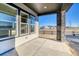 Covered patio with stone pillars offering outdoor living space at 8871 S Quemoy St, Aurora, CO 80016