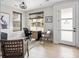 Cozy home office featuring a desk and chair by the window and stylish decor and light hardwood floors at 888 S Valentia St # 101, Denver, CO 80247