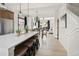 Open-concept kitchen with a long island that also has bar seating and overlooks the living area at 888 S Valentia St # 101, Denver, CO 80247