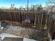 Small backyard with gravel and grill at 2218 Coronado N Pkwy # B, Denver, CO 80229