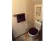 Small bathroom with a toilet and a burgundy bathmat at 2218 Coronado N Pkwy # B, Denver, CO 80229