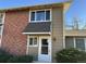 Brick front exterior of a bi-level home with a white door at 2218 Coronado N Pkwy # B, Denver, CO 80229