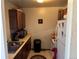 Small kitchen with wood cabinets and standard appliances at 2218 Coronado N Pkwy # B, Denver, CO 80229