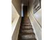 Staircase leading to the upper level of the home at 2218 Coronado N Pkwy # B, Denver, CO 80229