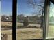 View from window shows trees and street at 2218 Coronado N Pkwy # B, Denver, CO 80229